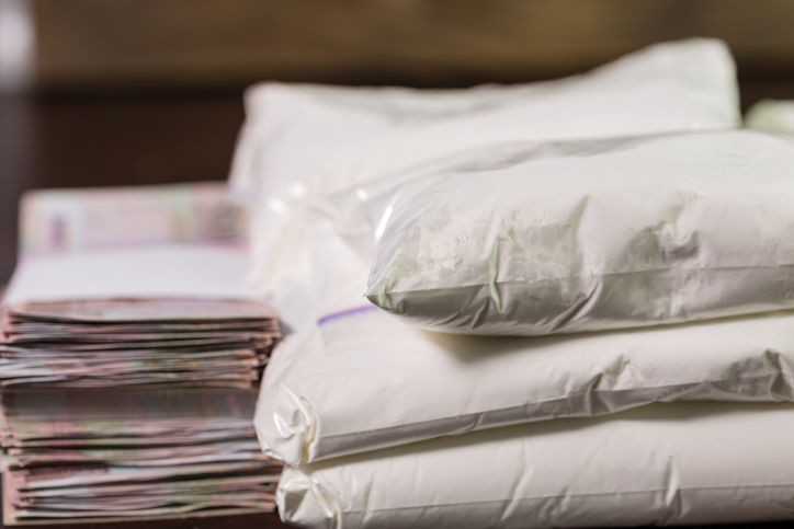 Bags of drugs, and money on table